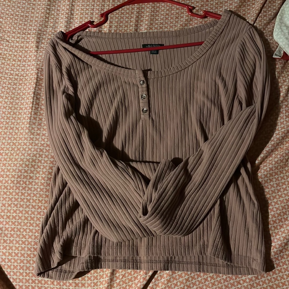 kind of like a beige purple/pink sweater. L
